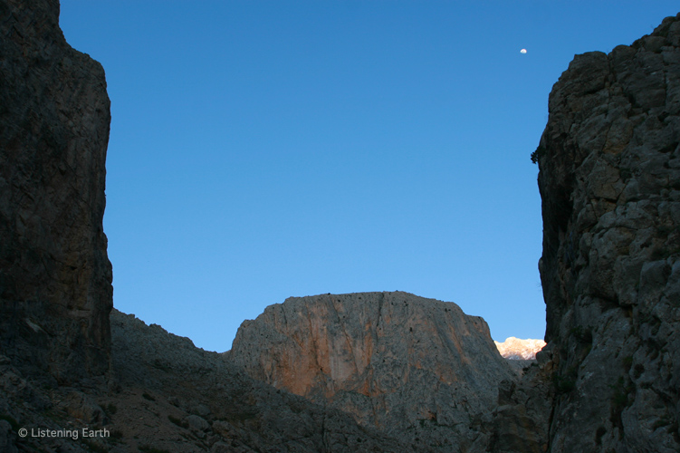 Moon hangs over the hidden gorge of Demerkazik, in the Taurus Mountains, Turkey