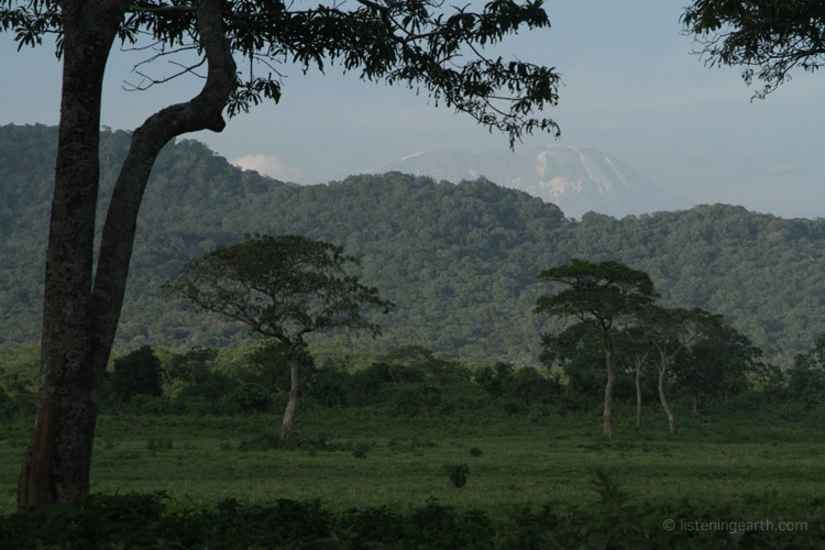 From the base of Mt. Meru, Kilimanjaro can be seen on the horizon 70km distant